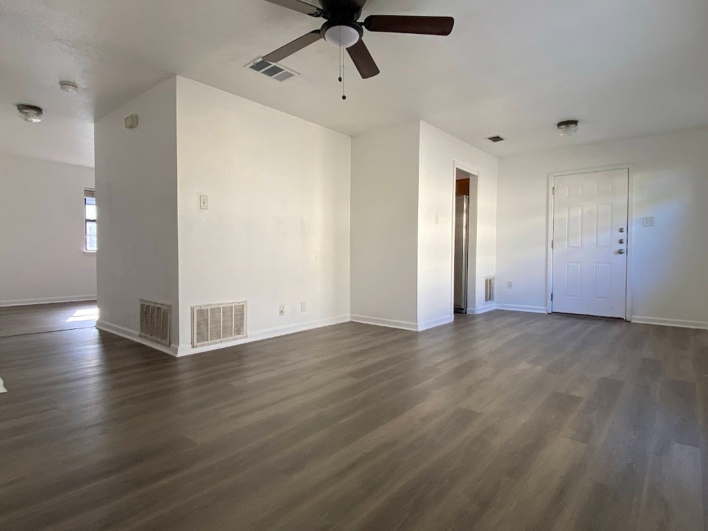 5813 Signal Point Austin, TX 78724 - Photo 5 of 12 a view of a livingroom with wooden floor and a ceiling fan