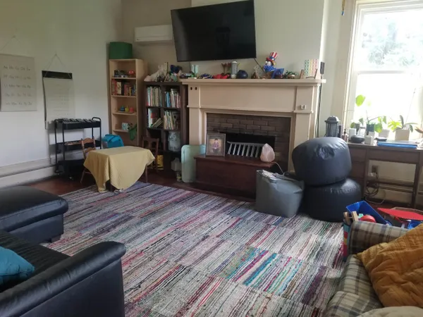 a living room with furniture and a fireplace
