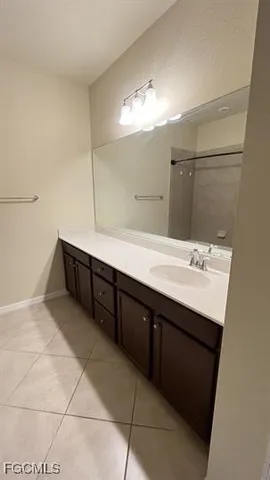 a bathroom with a sink double vanity and a mirror