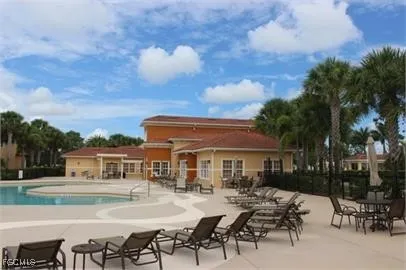 a view of a patio with table and chairs and potted plants