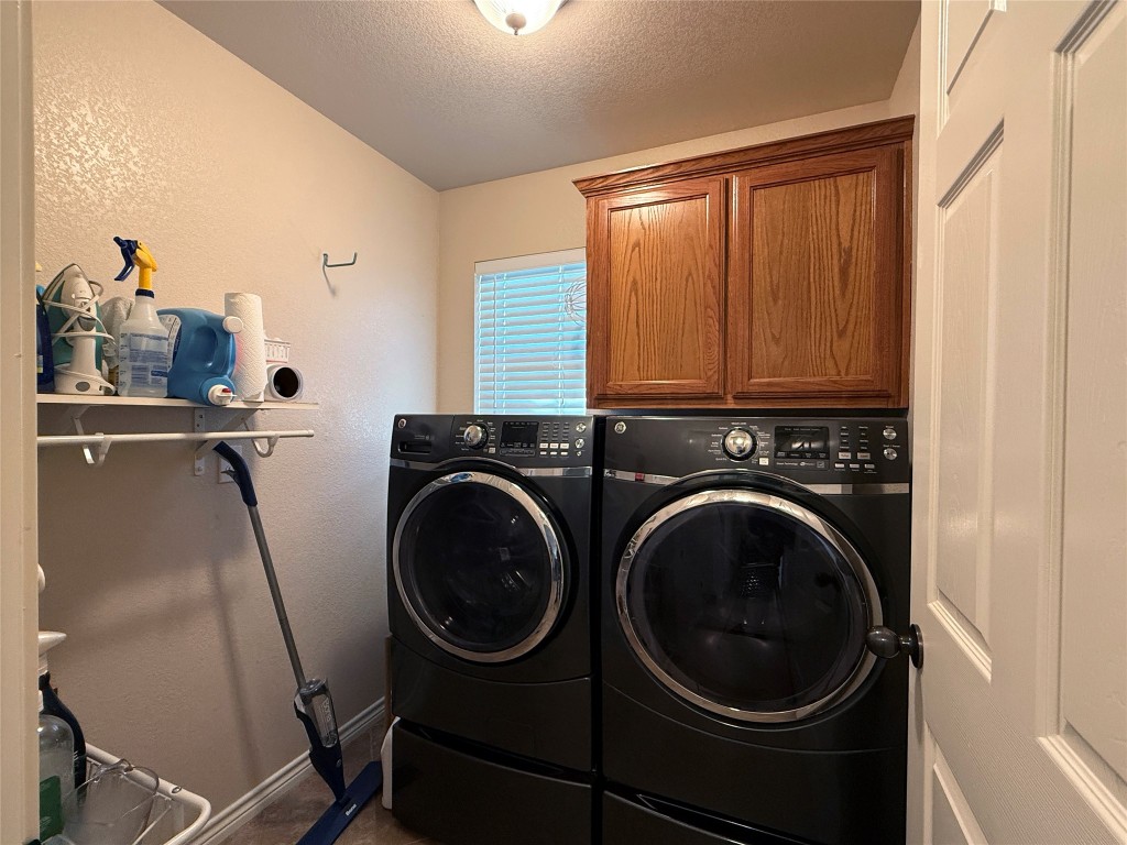 1502 Hamilton Street Burnet, TX 78611 - Photo 11 of 26 a utility room with dryer and washer