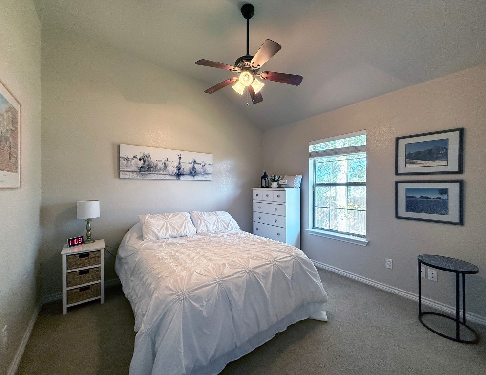 1502 Hamilton Street Burnet, TX 78611 - Photo 18 of 26 a bedroom with a bed and a window
