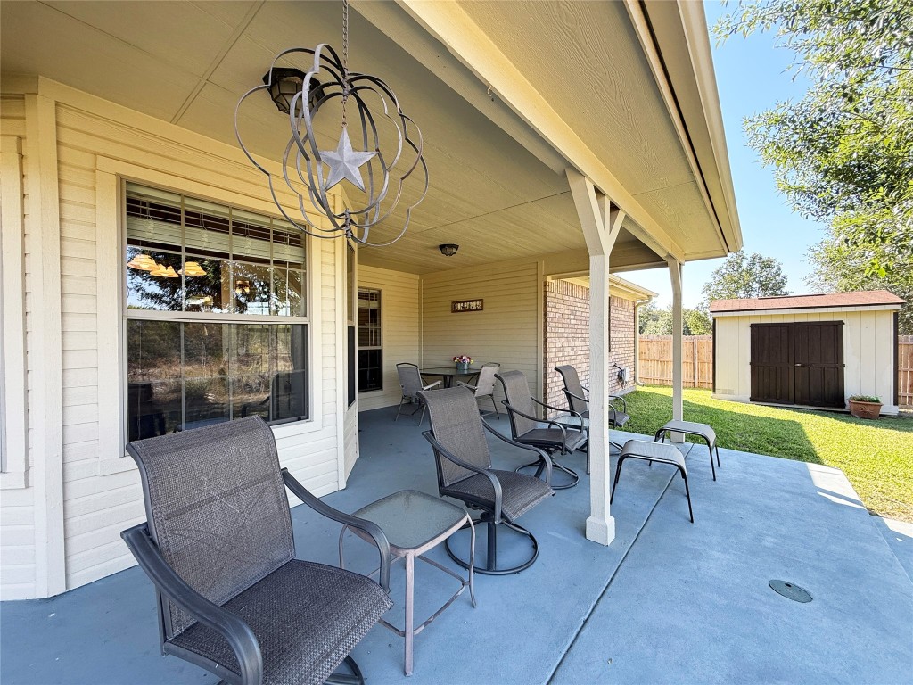 1502 Hamilton Street Burnet, TX 78611 - Photo 23 of 26 a view of a patio with couches table and chairs