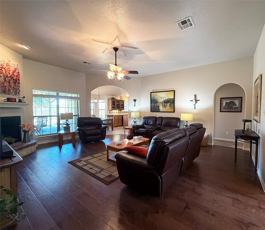 1502 Hamilton Street Burnet, TX 78611 - Photo 5 of 26 a living room with fireplace furniture and a wooden floor