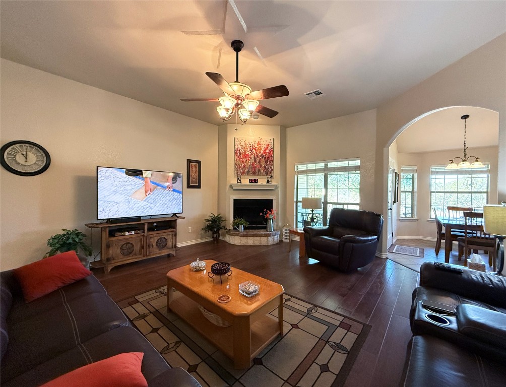1502 Hamilton Street Burnet, TX 78611 - Photo 6 of 26 a living room with furniture a fireplace and a flat screen tv