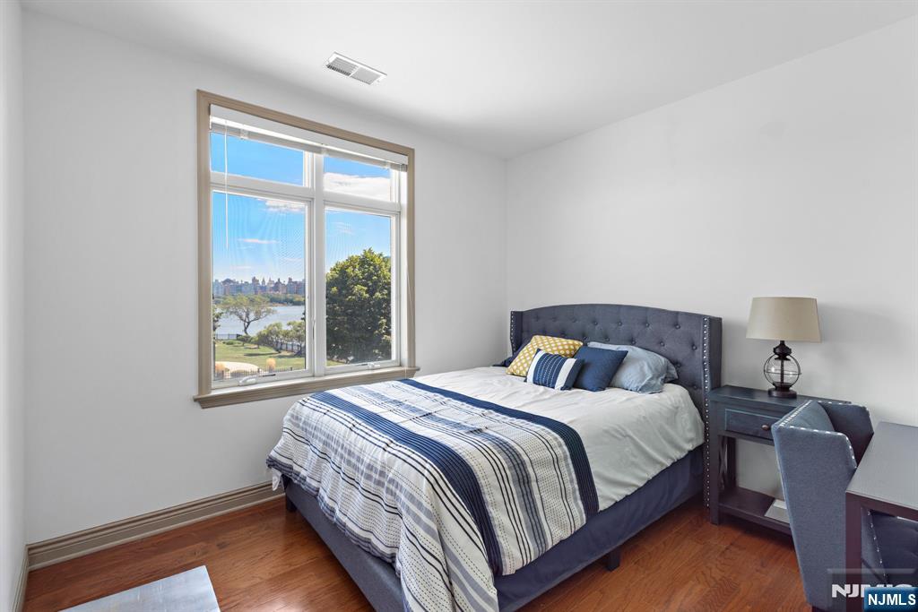 7400 River Road, Unit 208 North Bergen, NJ 07047 - Photo 12 of 18 a bedroom with a bed and a window