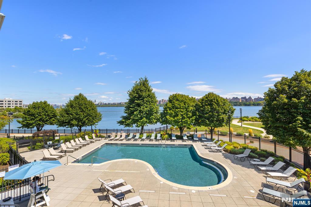 7400 River Road, Unit 208 North Bergen, NJ 07047 - Photo 15 of 18 a view of swimming pool with outdoor seating