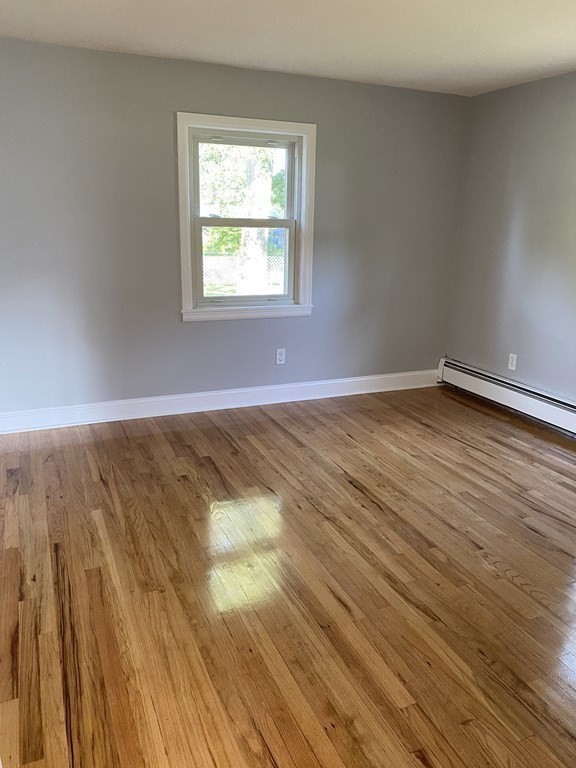 47 Bourbeau Street Chicopee, MA 01020 - Photo 11 of 19 a view of an empty room and wooden floor