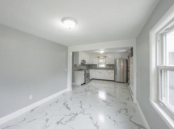 47 Bourbeau Street Chicopee, MA 01020 - Photo 14 of 19 a view of a kitchen with windows