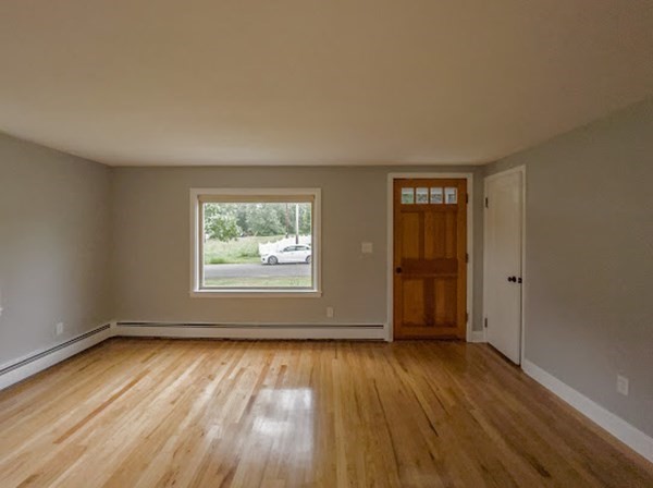 47 Bourbeau Street Chicopee, MA 01020 - Photo 16 of 19 an empty room with wooden floor and windows