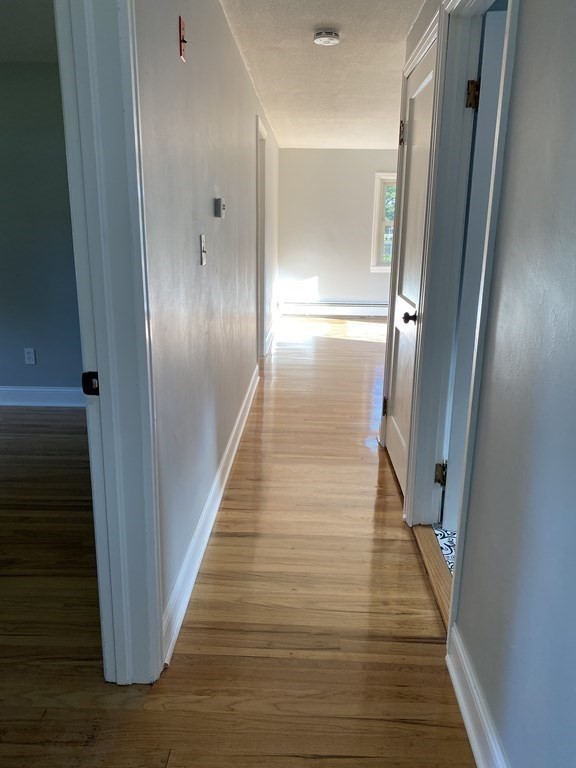 47 Bourbeau Street Chicopee, MA 01020 - Photo 8 of 19 a view of a hallway with wooden floor