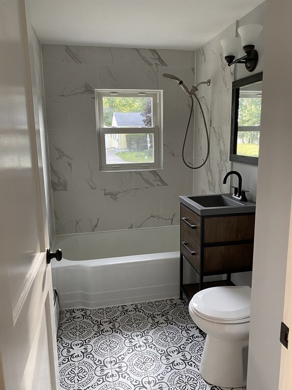 47 Bourbeau Street Chicopee, MA 01020 - Photo 9 of 19 a bathroom with a toilet sink and bathtub