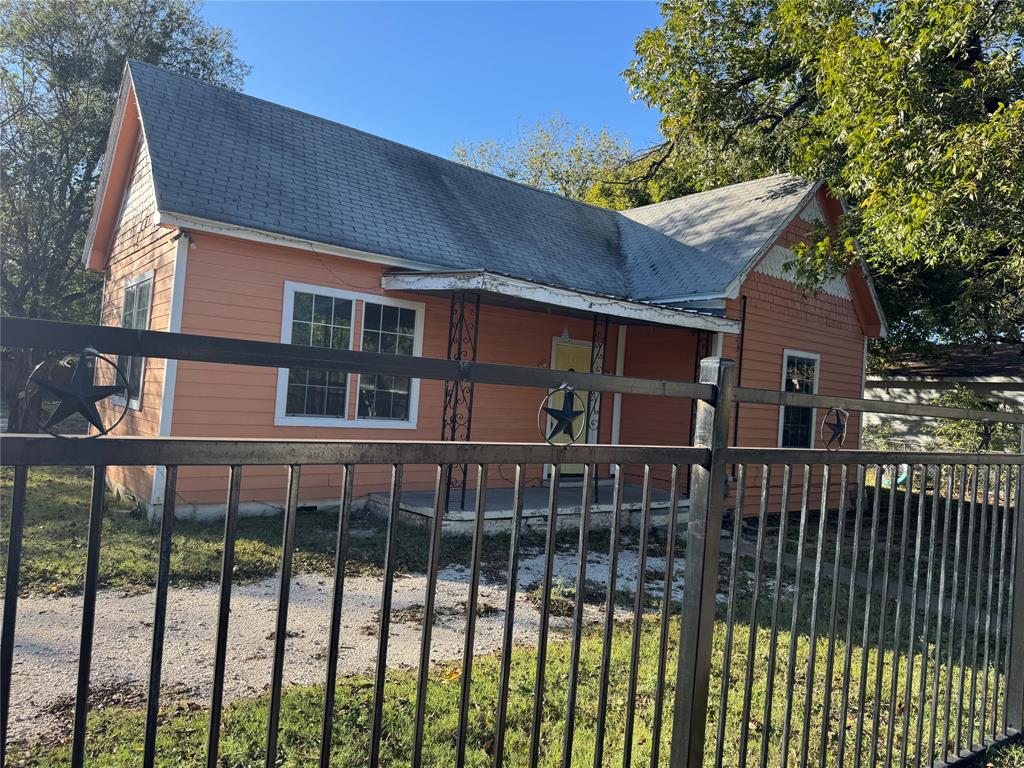a view of a brick house with a large window