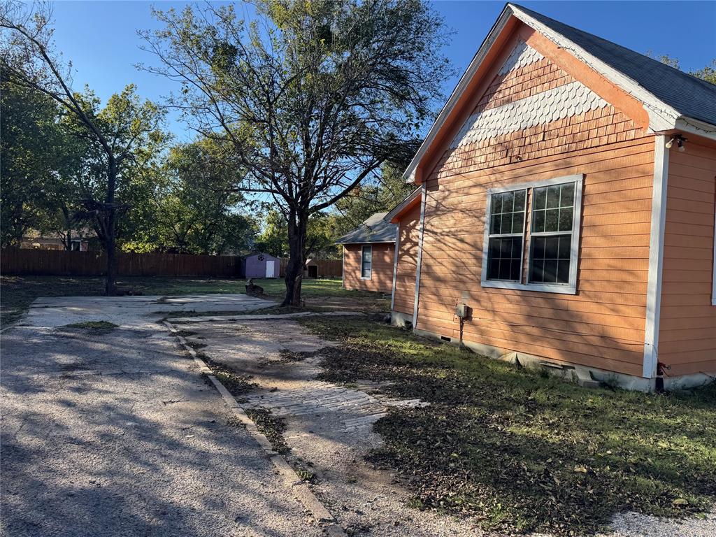 309 Elmo Street Cleburne, TX 76031 - Photo 3 of 5 a view of backyard with green space