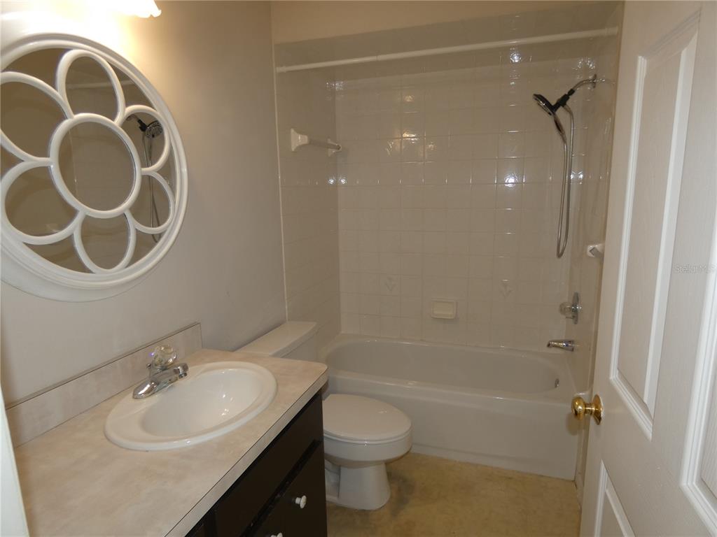 19181 Southwest 90th Ln Road Dunnellon, FL 34432 - Photo 12 of 37 a bathroom with a sink and a mirror