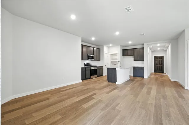 a view of swimming pool with outdoor seating and yard in back