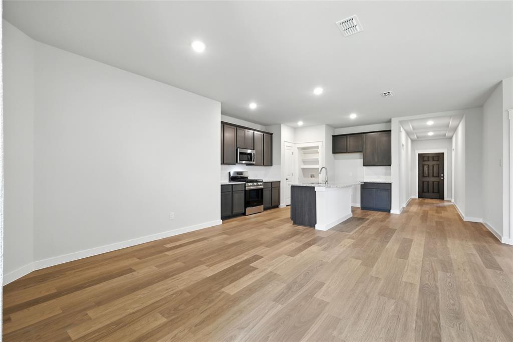 604 Martell Road Princeton, TX 75407 - Photo 37 of 38 a view of a kitchen with a sink and an empty room