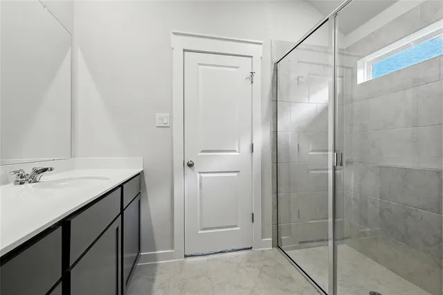 a bathroom with double sink and a mirror