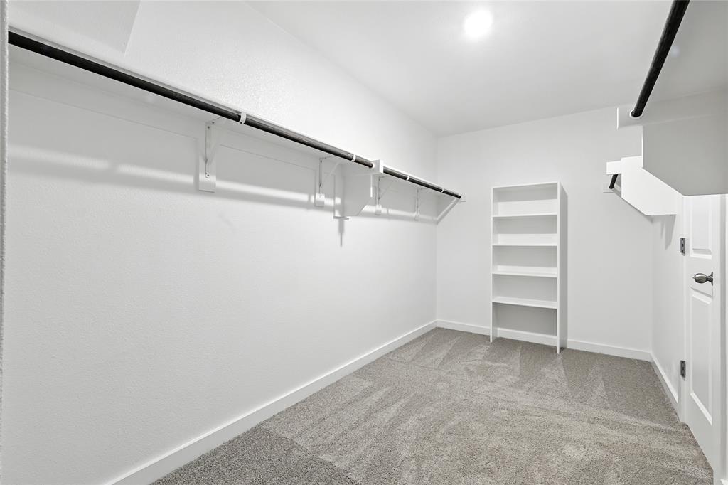 604 Martell Road Princeton, TX 75407 - Photo 24 of 38 a view of an empty walk in closet