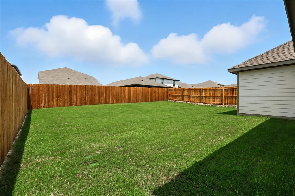 604 Martell Road Princeton, TX 75407 - Photo 27 of 38 a view of a backyard with a garden