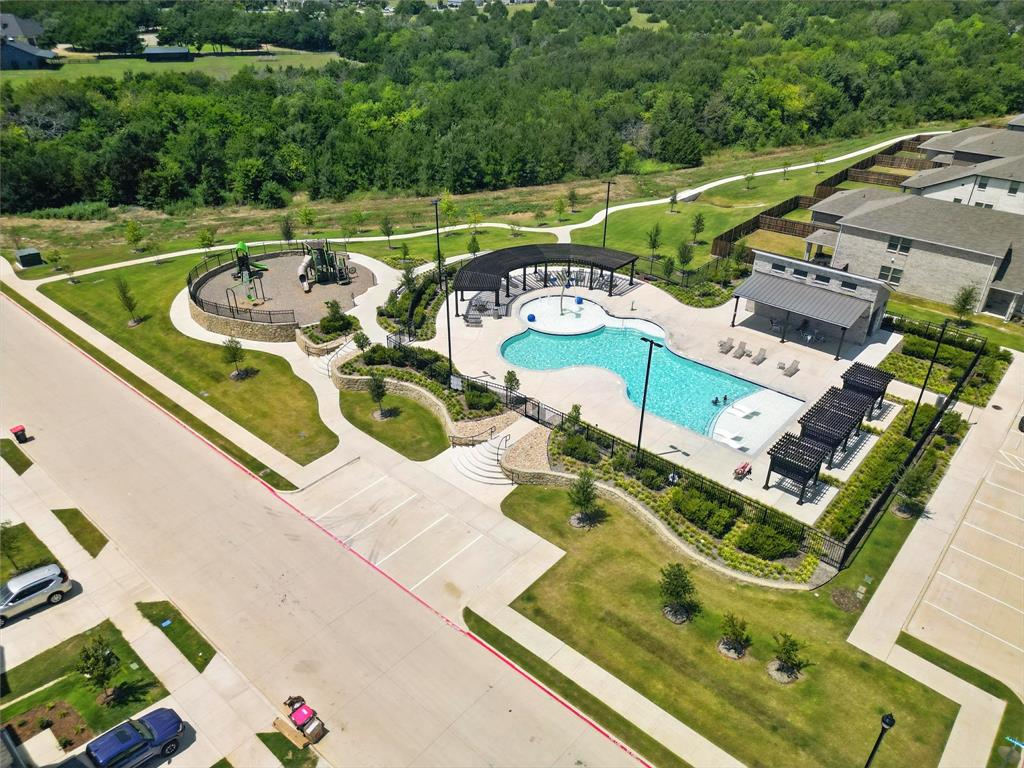 604 Martell Road Princeton, TX 75407 - Photo 33 of 38 an aerial view of a tennis ground and a cars park