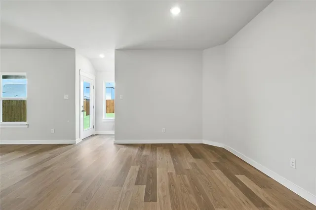 a view of wooden floor in an empty room