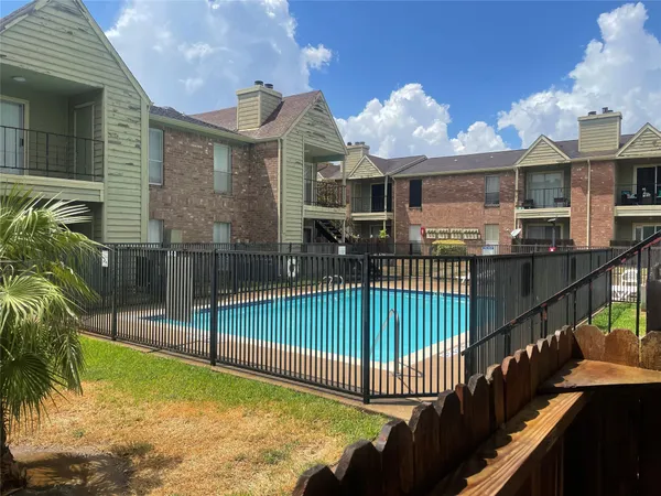 a view of a house with a wooden deck