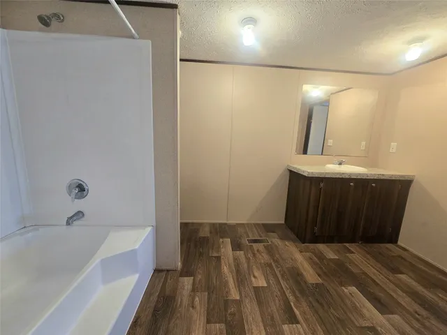 a bathroom with a sink and a bathtub