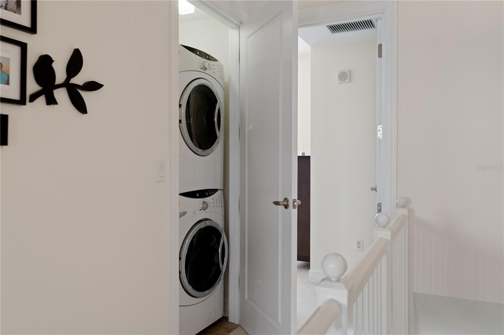 331 Cleveland Street, Unit 312 Clearwater, FL 33755 - Photo 17 of 36 a view of a hallway with washer and dryer