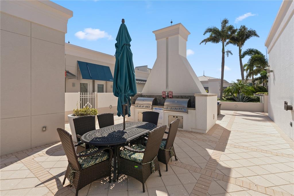 331 Cleveland Street, Unit 312 Clearwater, FL 33755 - Photo 25 of 36 a dining room with furniture and wooden floor