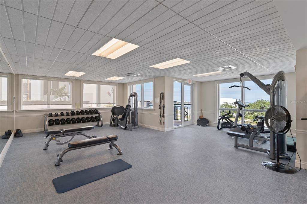 331 Cleveland Street, Unit 312 Clearwater, FL 33755 - Photo 28 of 36 a view of a livingroom with gym equipment and a large window