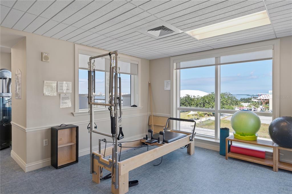 331 Cleveland Street, Unit 312 Clearwater, FL 33755 - Photo 29 of 36 a room with gym equipment and large windows