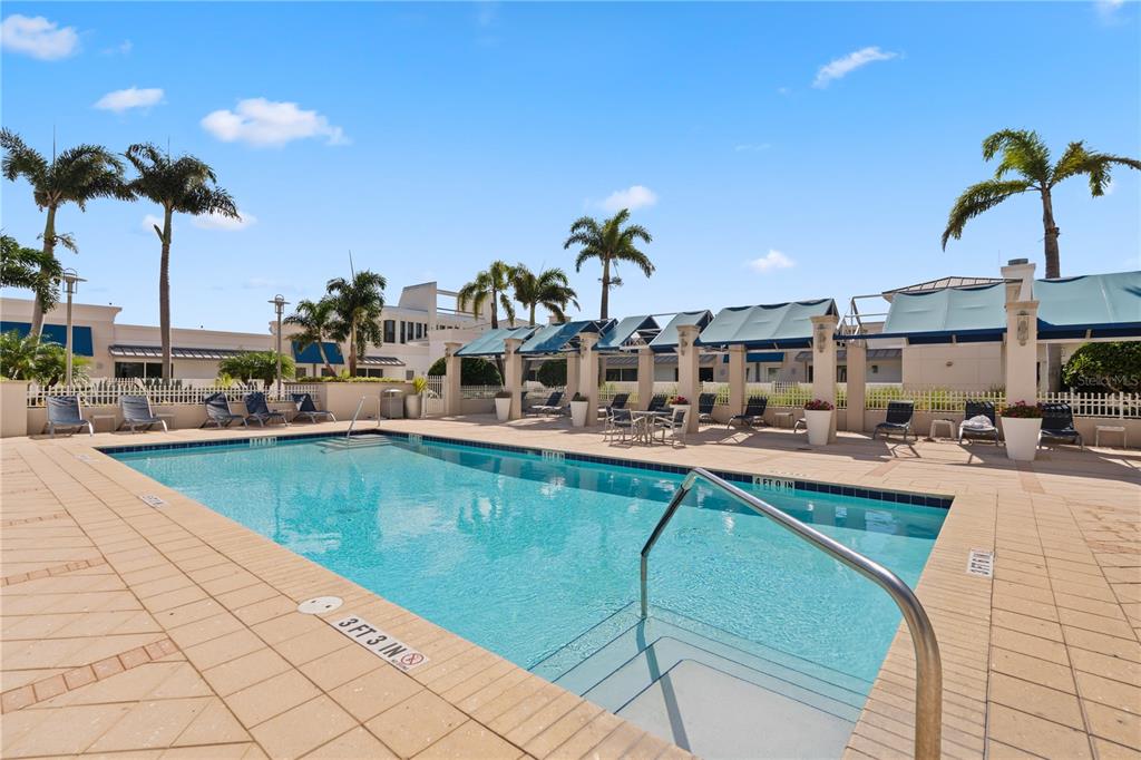 331 Cleveland Street, Unit 312 Clearwater, FL 33755 - Photo 30 of 36 a view of a swimming pool with outdoor seating