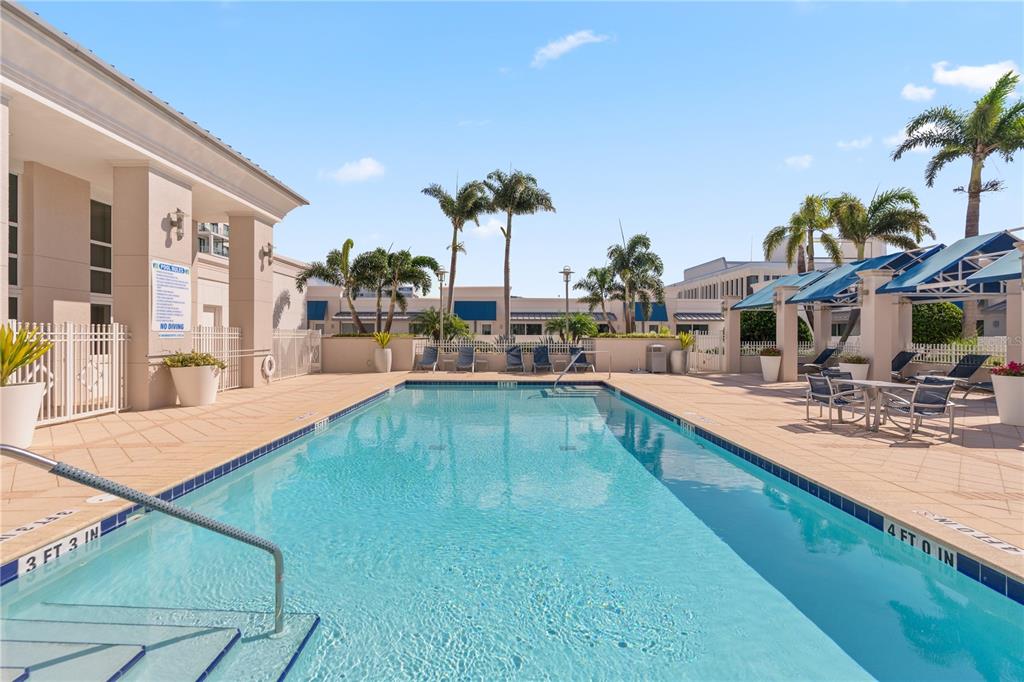 331 Cleveland Street, Unit 312 Clearwater, FL 33755 - Photo 31 of 36 a view of a swimming pool with outdoor seating