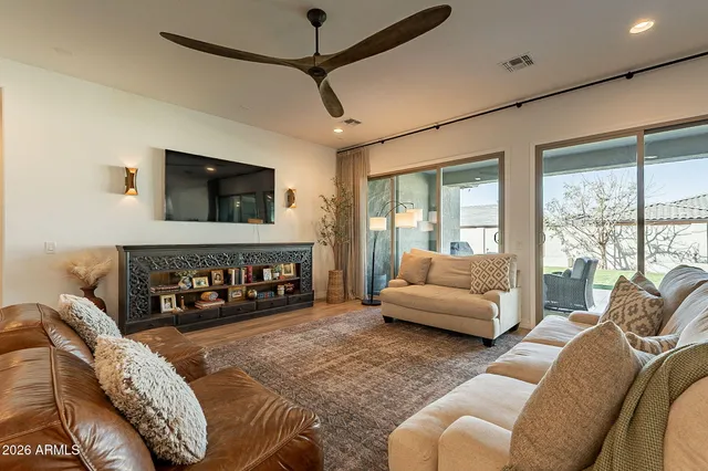 a living room with furniture and a large window