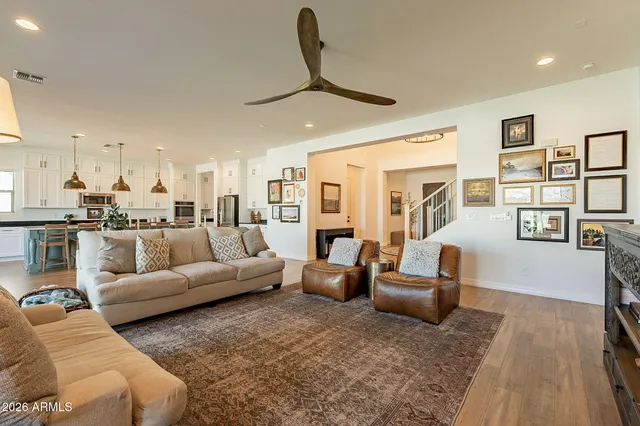 a large kitchen with lots of counter space dining table and stainless steel appliances