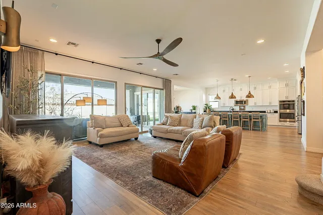 a kitchen with granite countertop white cabinets and stainless steel appliances