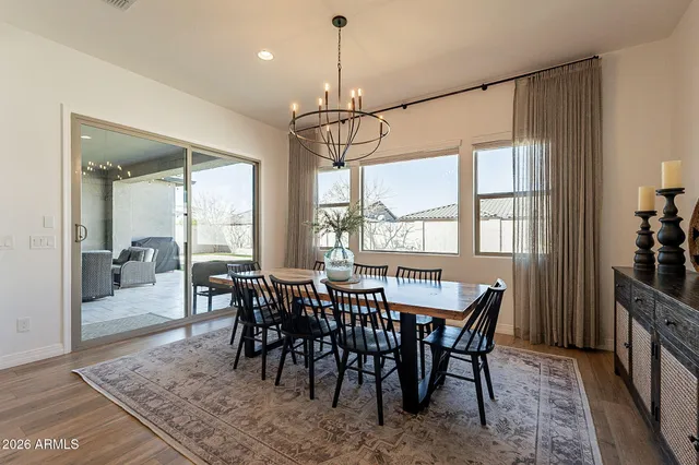a spacious bathroom with a bathtub sink and mirror