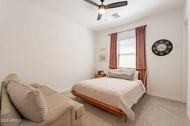 a bathroom with a shower a sink a toilet and a mirror