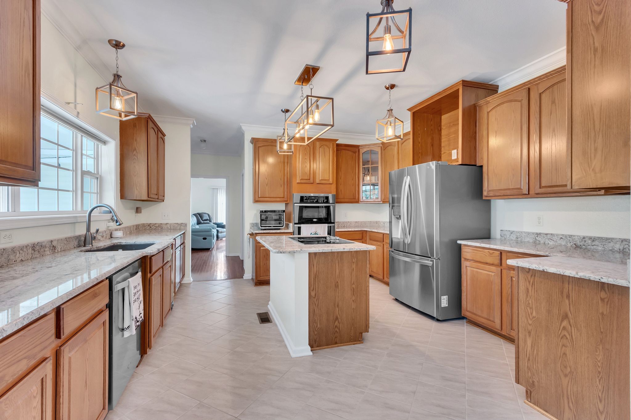 4595 Chestnut Ridge Road Columbia, TN 38401 - Photo 3 of 26 a kitchen with refrigerator cabinets and wooden floor
