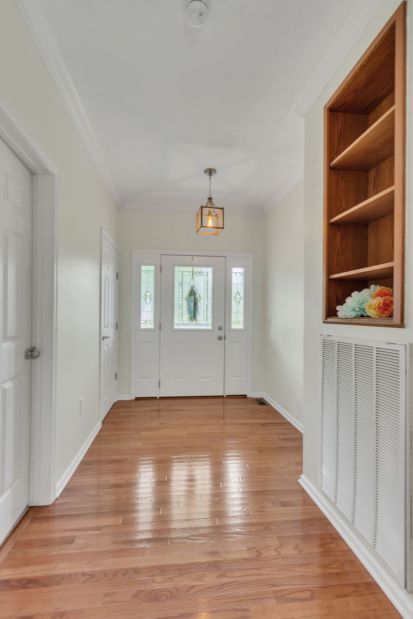 4595 Chestnut Ridge Road Columbia, TN 38401 - Photo 4 of 26 a view of an empty room with wooden floor and a window