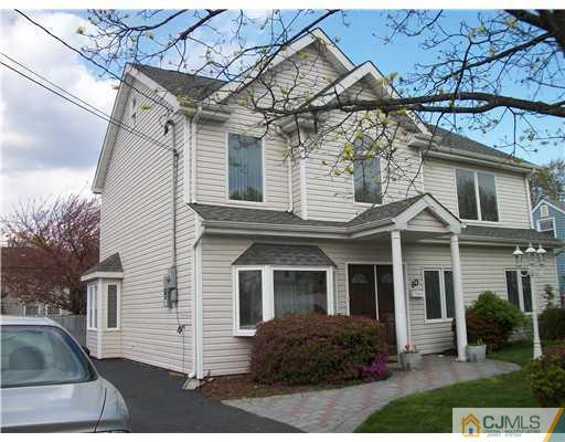 10 Brookville Road Edison, NJ 08817 - Photo 1 of 11 a front view of a house with a yard