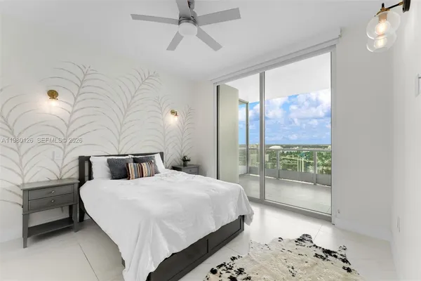 a bedroom with double bed and a window