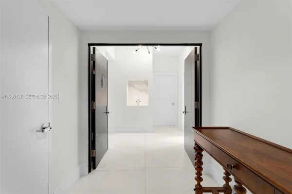 a view of an entryway with wooden floor