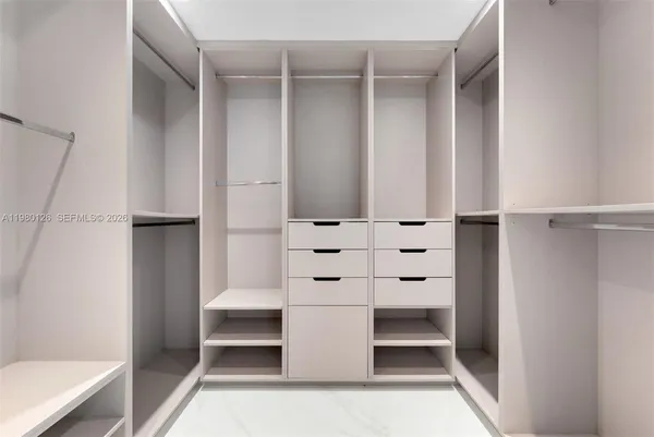 a view of an empty walk in closet