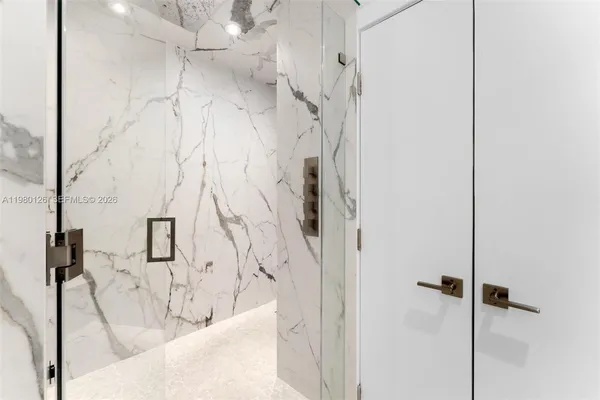 a bathroom with a bathtub and shower