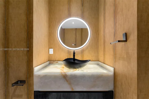 a bedroom with a bed and a mirror