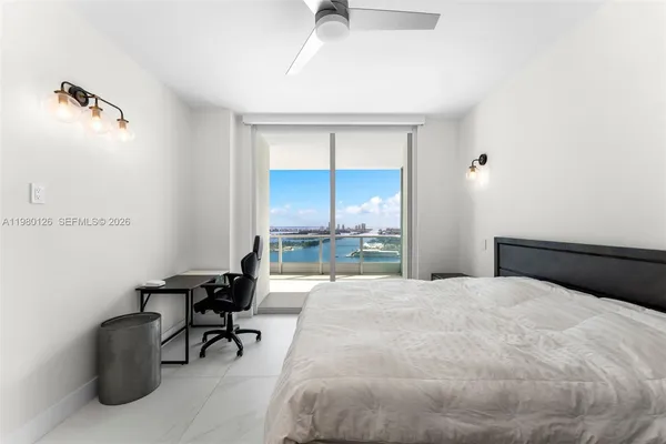 a bathroom with a double vanity sink mirror and shower