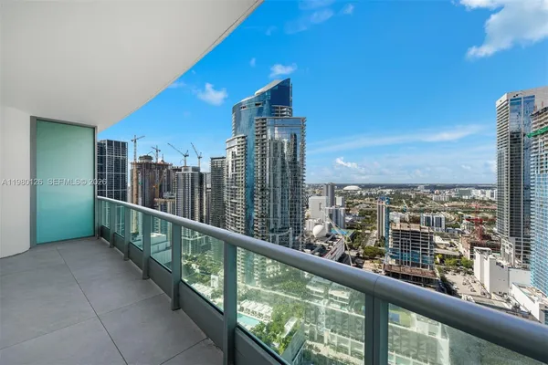 a view of a balcony with furniture