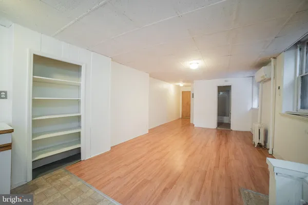 a view of a room with a wooden floor